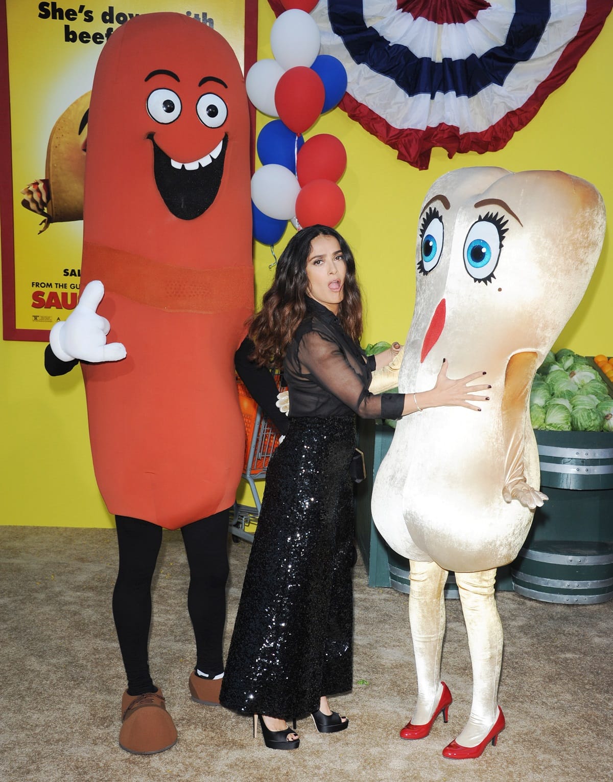 Actress Salma Hayek having fun with some of the characters from the film at the Premiere Of Sony's 'Sausage Party'