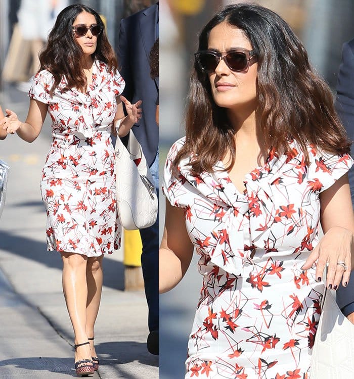 Salma Hayek wears a red-and-white floral print dress as she arrives at ABC Studios
