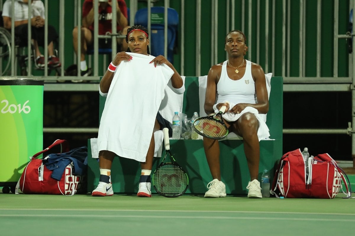 Serena and Venus Williams taking a break in their doubles match against Lucie Safarova and Barbora Strycova of the Czech Republic on Day 2 of the Rio 2016 Olympic Games