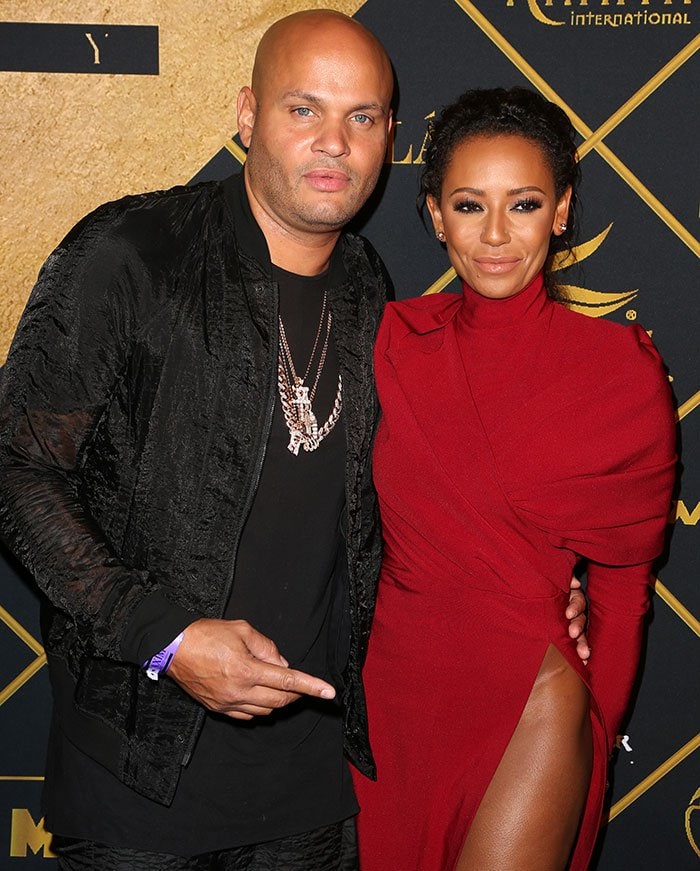 Stephen Belafonte cheekily points at Mel B's crotch in admiration of her daring outfit choice at the Maxim Hot 100 Party