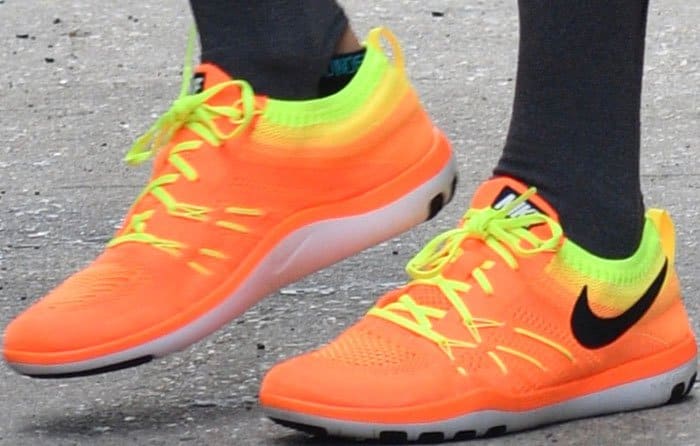 Taylor Swift wears bright orange Nike Free Flyknit 'TR Focus' sneakers