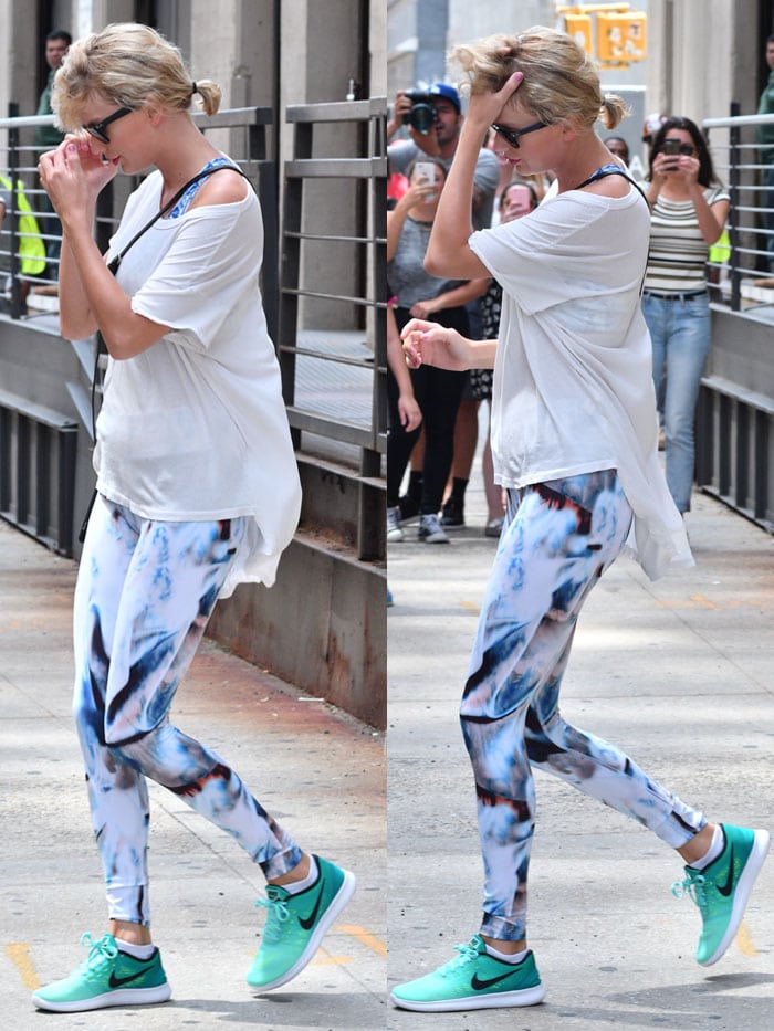 Taylor Swift spotted leaving the gym, effortlessly rocks a stylish yet comfortable look, pairing a Victoria's Secret sports bra with a crisp white t-shirt from The Great, showcasing her impeccable fashion sense even during her workout routine