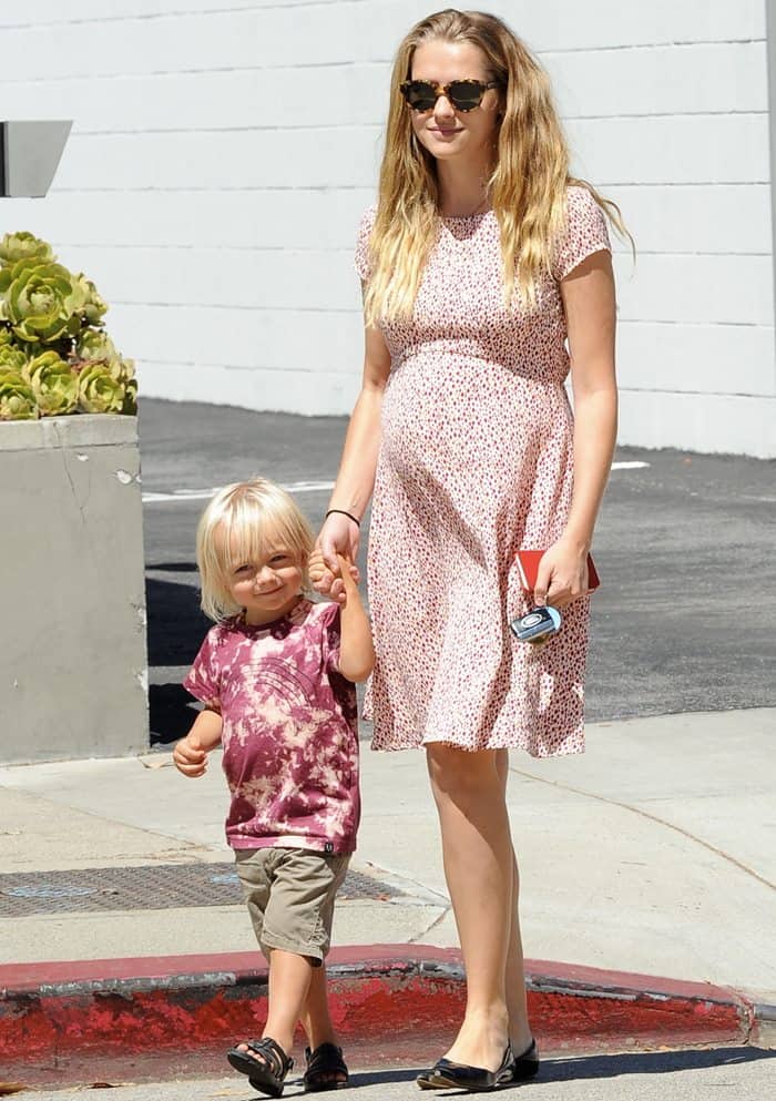 Bodhi Rain Palmer, the son of Australian actress Teresa Palmer and American actor Mark Webber, walks with his mom in Los Angeles