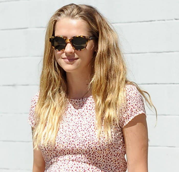 Teresa Palmer exhibited a remarkable glow that perfectly harmonized with her chic choice of attire—a delightful spotted summer dress