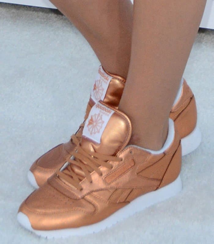 Tove Lo's feet in metallic Reebok sneakers