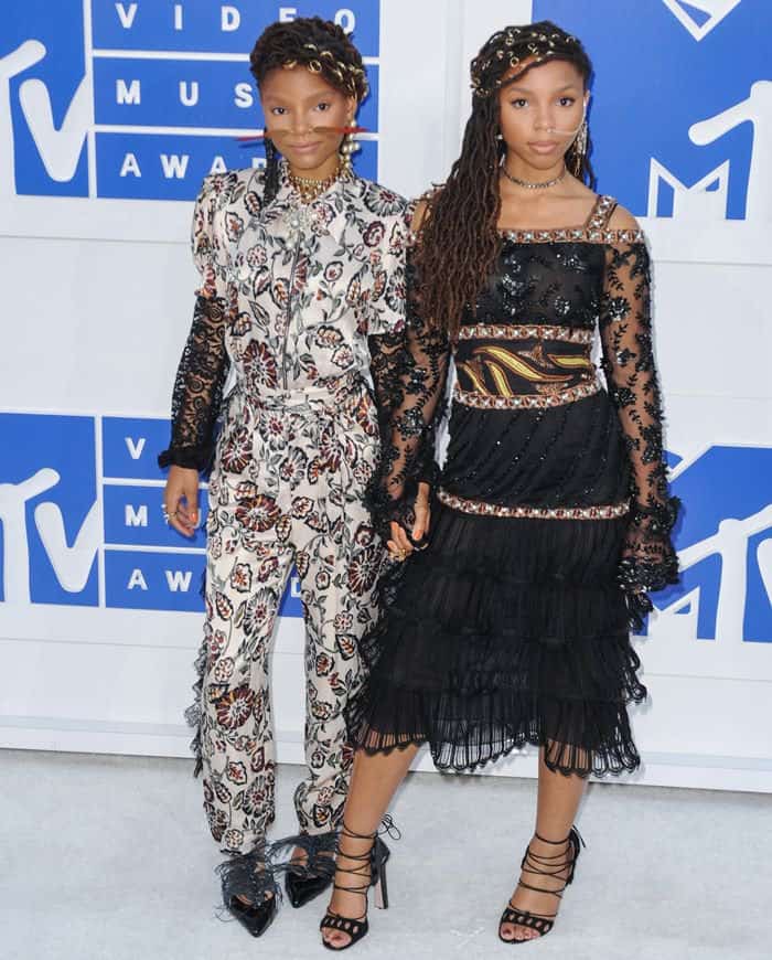 Chloe and Halle Bailey showcase their unique style at the 2016 MTV Video Music Awards in intricately detailed Rodarte ensembles, featuring bold patterns and statement accessories