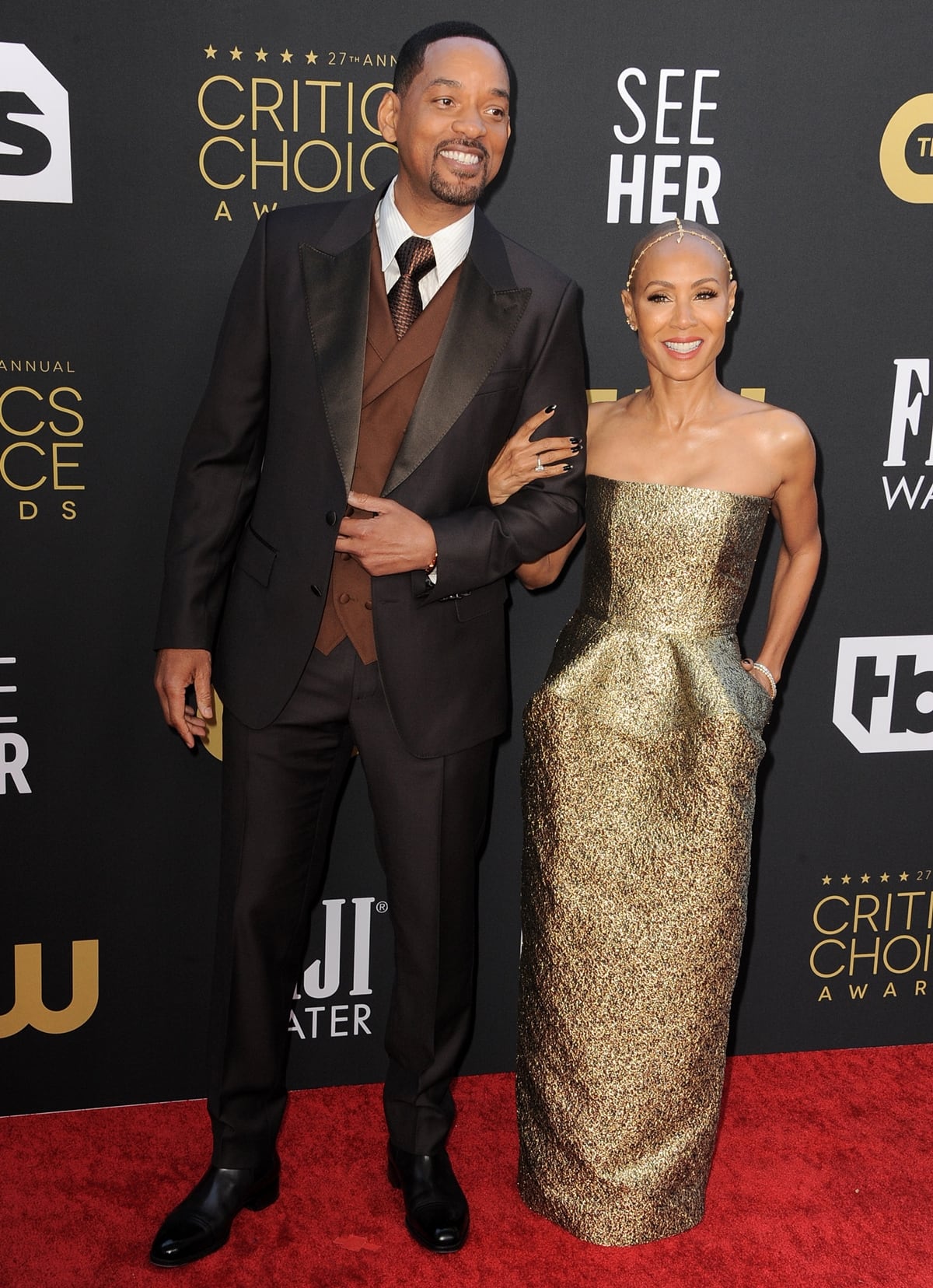Will Smith and his wife Jada Pinkett Smith, who wore a gold strapless dress and a diamond headpiece by Jacquie Aiche, at the 27th annual Critics Choice Awards