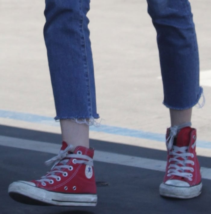 Emma Roberts rocks red Converse sneakers with rubber toe caps and contrasting side walls