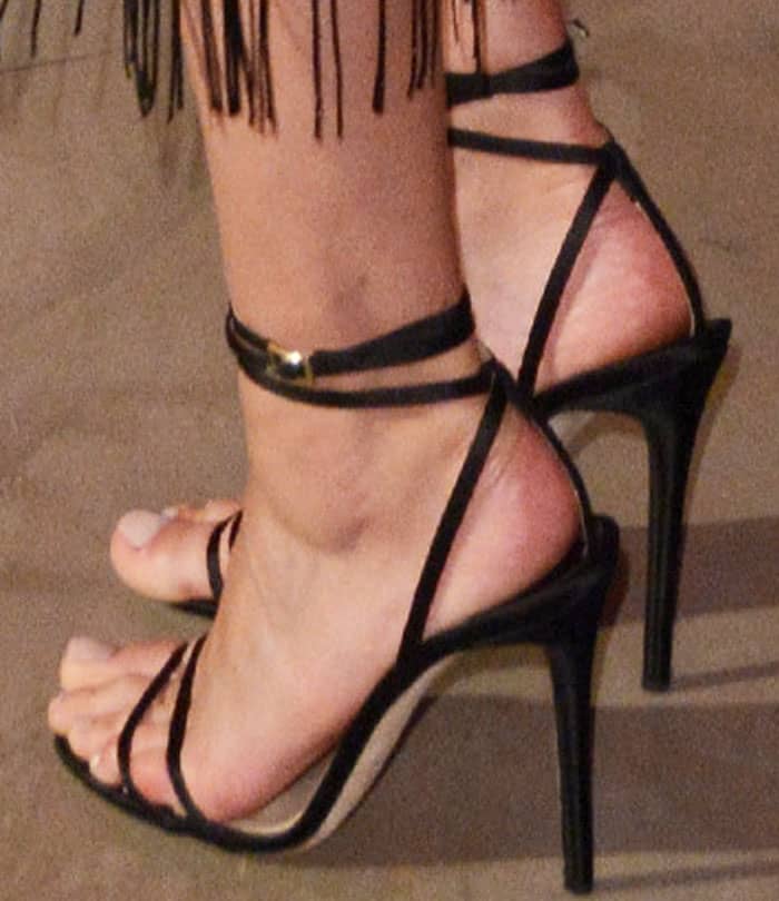 Amber Valletta showed off her feet in Jimmy Choo's "Tizzy" sandals to celebrate the brand's 20th anniversary