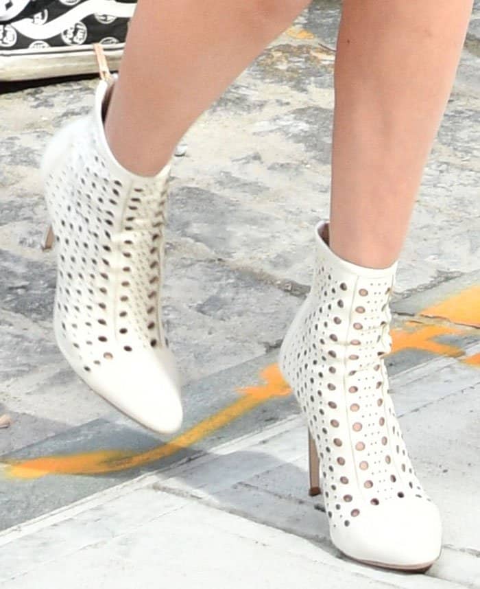 Bella Hadid rocks Tamara Mellon boots with laser-cut holes in varying sizes