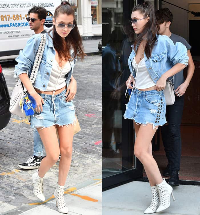 Bella Hadid flaunts her legs in a denim jacket and mini skirt