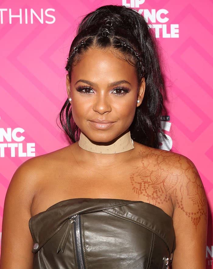 Christina Milian's strapless outfit highlighted her henna shoulder tattoo