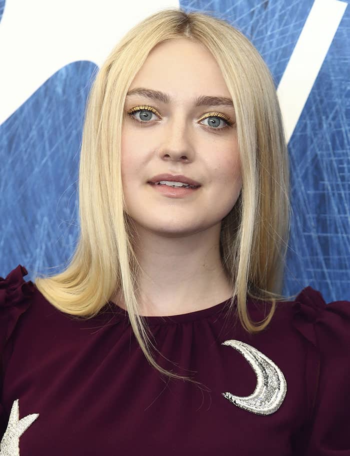 Dakota Fanning with straightened locks and gold eyeshadow