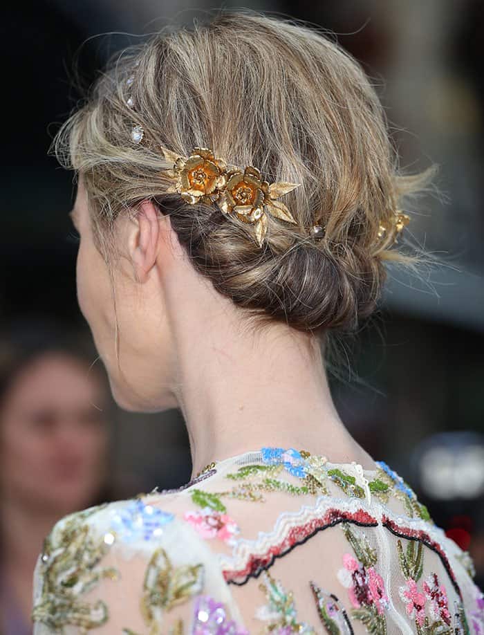 Emily Blunt with a pearl and gold flower crown intricately woven into her updo at "The Girl on the Train" world premiere