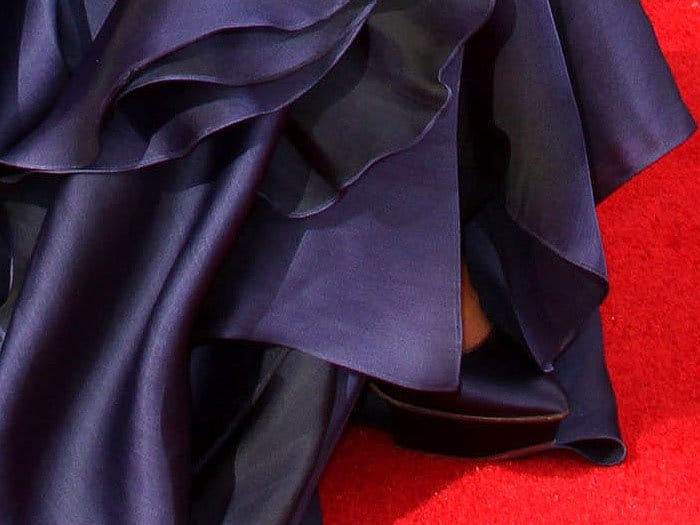 Charlotte Olympia navy satin platform pumps peeking out from underneath Emily Ratajkowski's gown