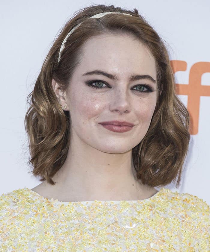 Emma Stone elevated her ensemble with Randall Scott starburst earrings