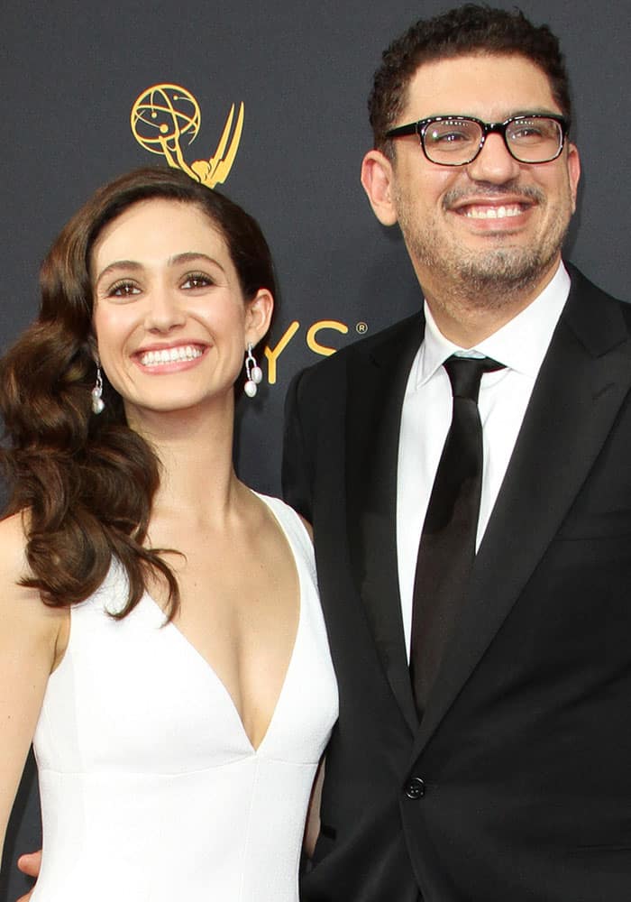 Emmy Rossum poses on the red carpet with her fiancé Sam Esmail