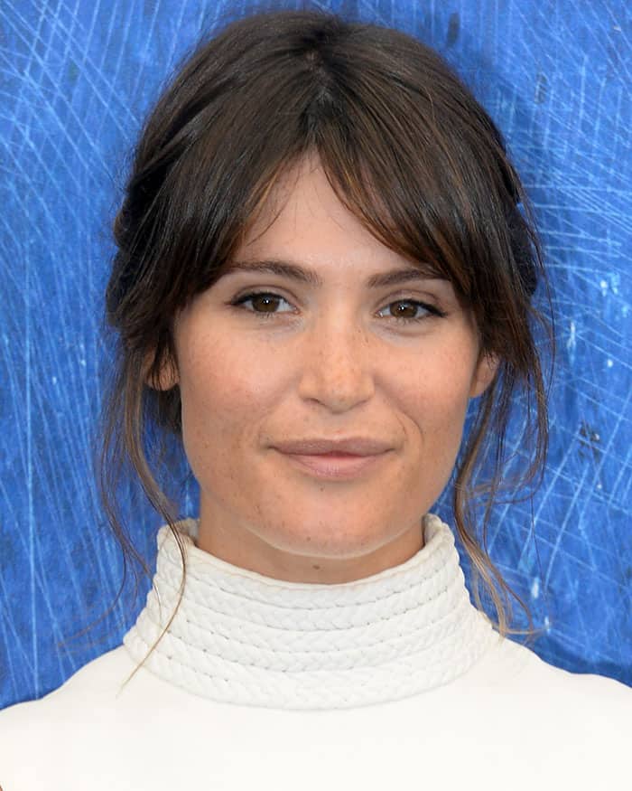 Gemma Arterton styled her hair in a relaxed bun, letting her natural beauty stand out with understated makeup