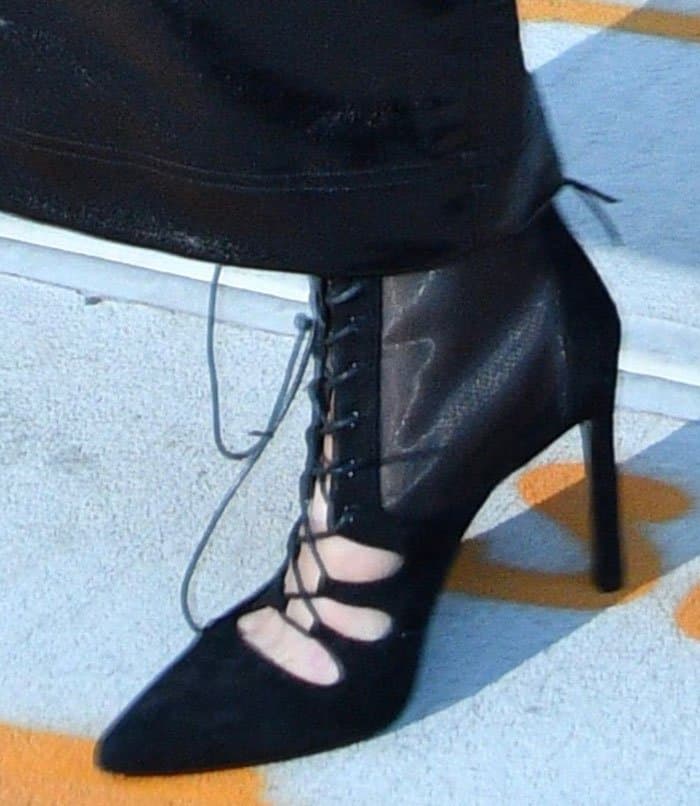 Gigi Hadid wears Stuart Weitzman's black suede Dramaqueen booties