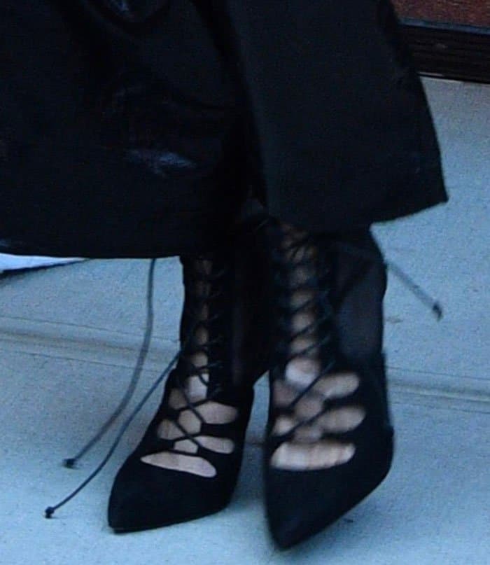 To complete her chic look, Gigi Hadid opted for black lace-up pumps by Stuart Weitzman
