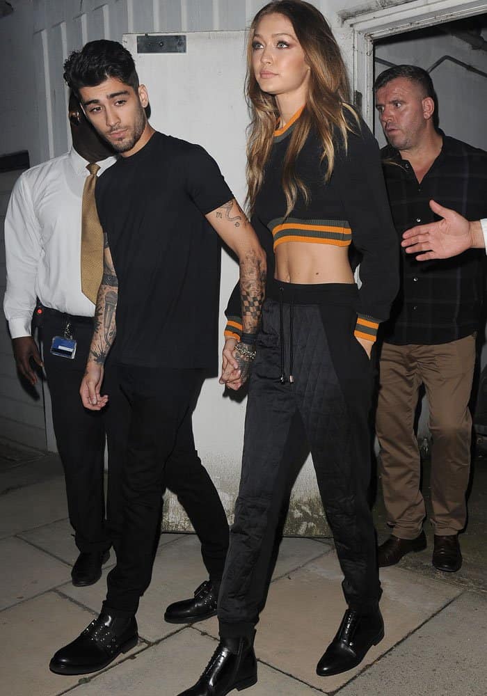 Gigi Hadid leaves the Versace Versus show with boyfriend Zayn Malik