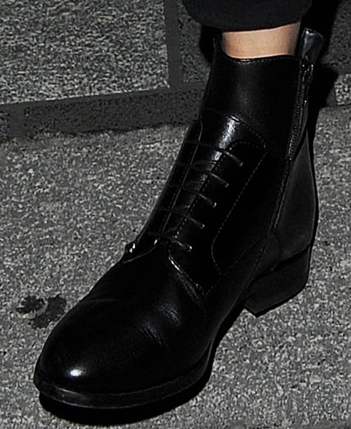 Gigi Hadid adds spunk to her athleisure look with a pair of Versus Versace boots