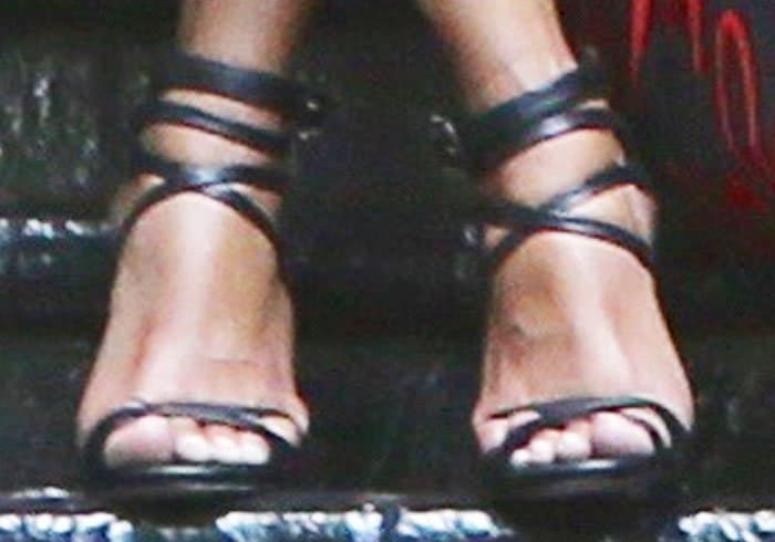 Halle Berry flaunts her feet in timeless black Le Silla strappy sandals, proving that classic designs never go out of style