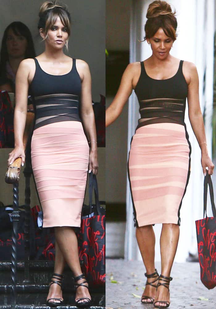 Sporting a form-fitting, two-toned bodycon dress with intricate wrap details on the bodice and skirt, designed by David Koma, Halle Berry looked every bit as stylish as her younger counterparts