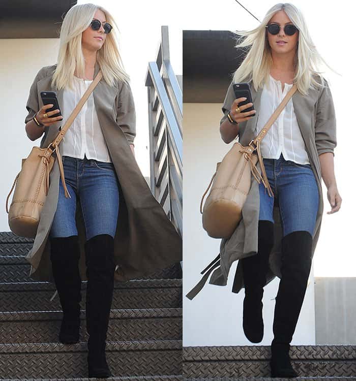 Julianne Hough chose a casual yet stylish ensemble: a white sheer button-up blouse paired with figure-hugging skinny jeans and a trench coat