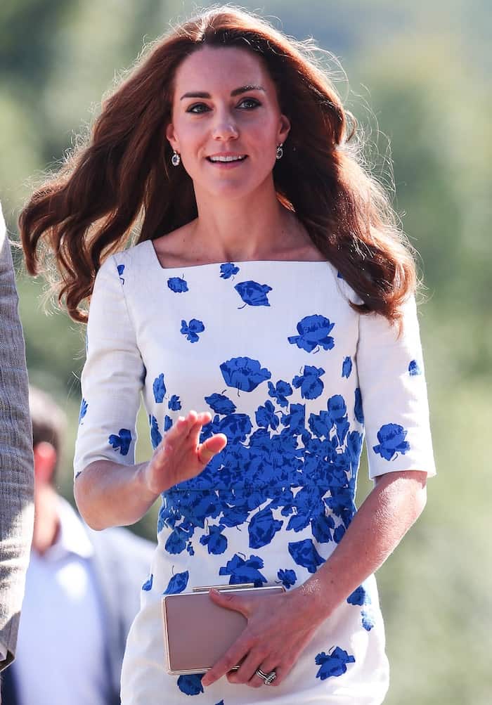 Kate Middleton looked elegant in her classic sheath dress featuring a squared neckline and notched sleeves