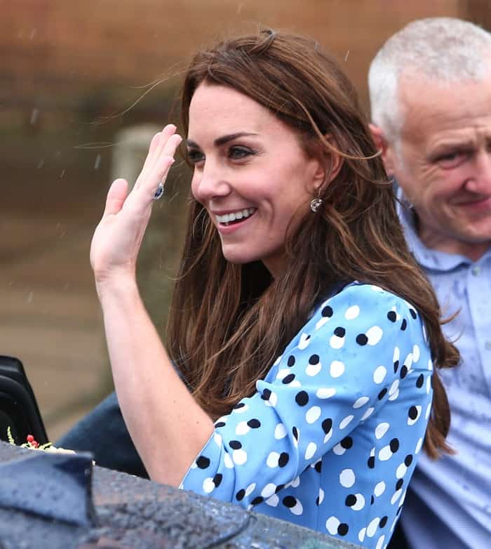 Kate Middleton waves to students and teachers as she arrives at the Stewards Academy