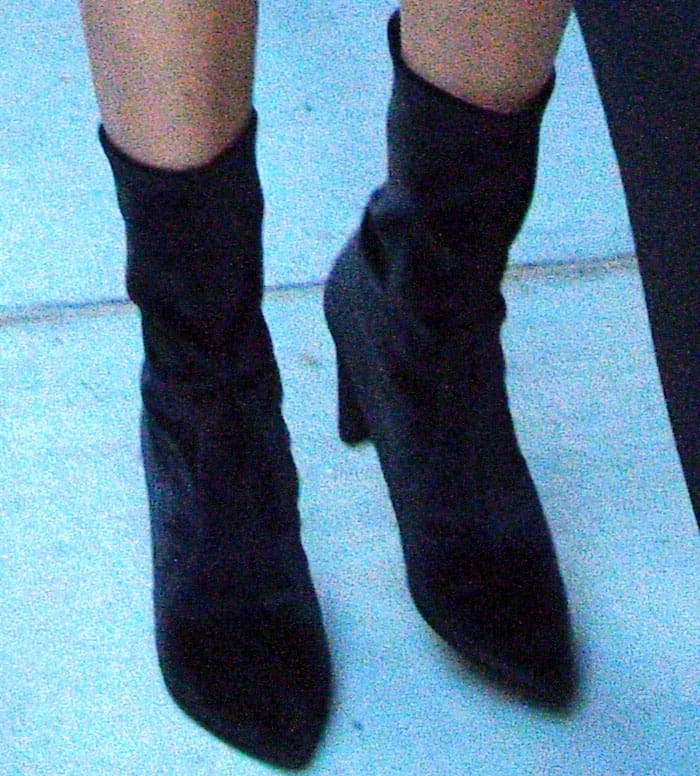 Kendall Jenner walked to her sister's apartment in a pair of Stuart Weitzman "Clinger" stretch velvet booties