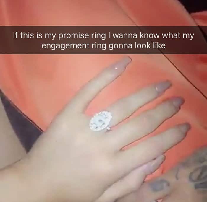 Kylie Jenner shows off her massive oval-shaped promise ring on Snapchat, playfully wondering what her engagement ring might look like