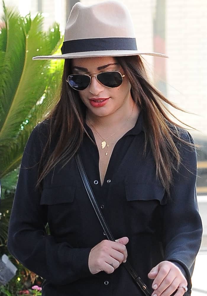 Lea Michele wears a Brixton Tara fedora and Ray-Ban Rb3025 Original Aviator sunglasses in West Hollywood