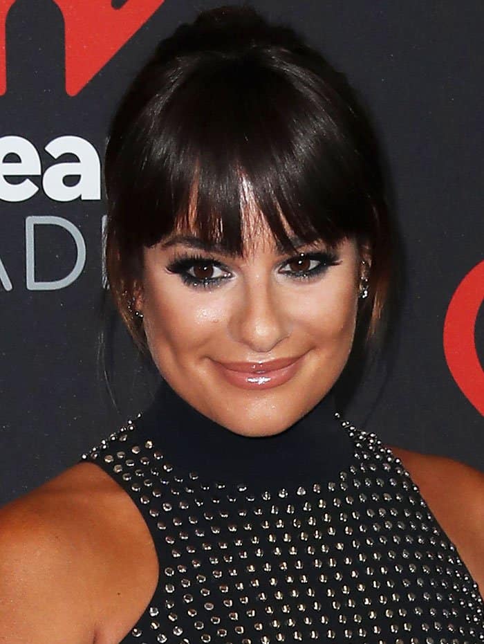 Lea Michele's hairstyle, a braided ponytail with fringe, framed a makeup-enhanced face