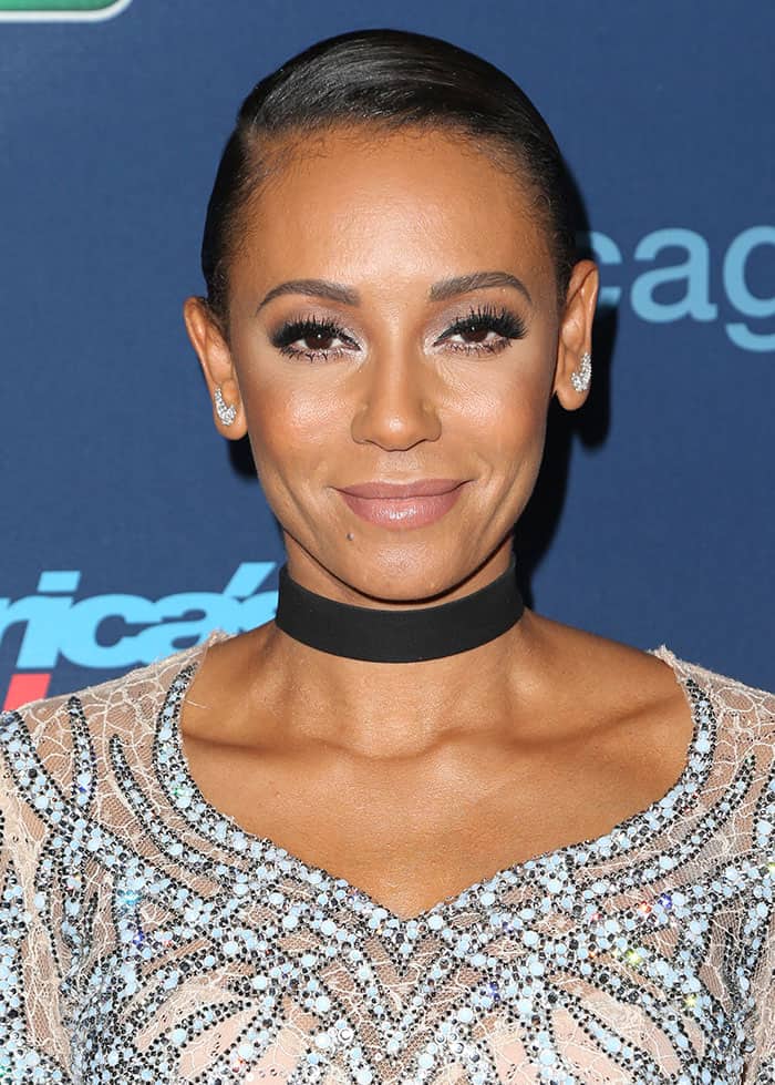 Mel B chose a sleek updo for her hair and enhanced her features with subtle makeup, highlighting her eyes with deep eyeliner and mascara