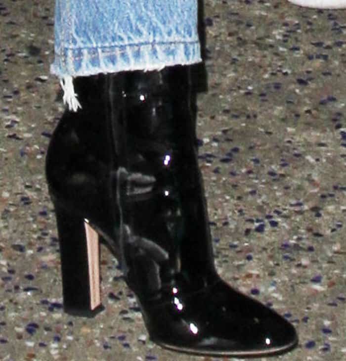 Miranda Kerr wears Gianvito Rossi's "Brandy" ankle boots in black patent leather