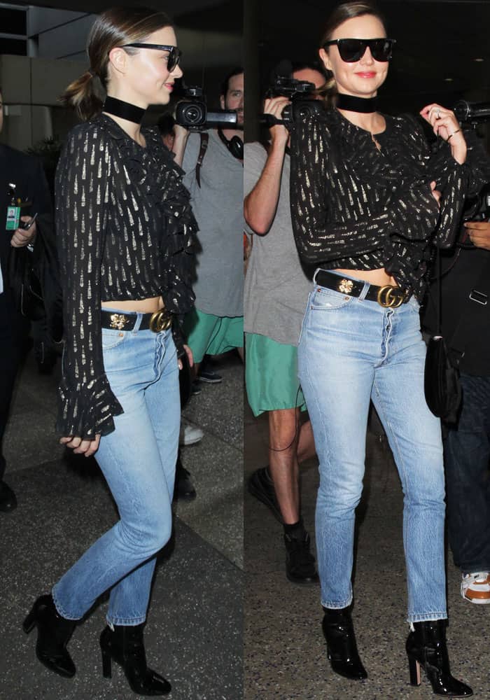 Miranda Kerr towers in a Roberto Cavalli top and Re/Done Straight skinny jeans at the Los Angeles Airport