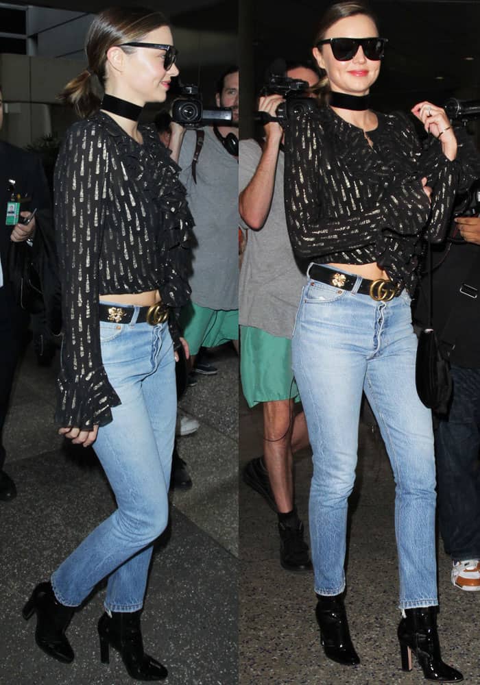 Miranda Kerr exudes effortless airport chic in a ruffled Roberto Cavalli top, Re/Done skinny jeans, and sleek Gianvito Rossi patent boots at LAX