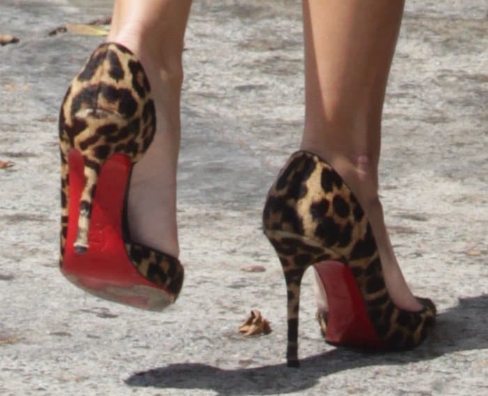 Reese Witherspoon wearing leopard Christian Louboutin "Iriza" red sole pumps