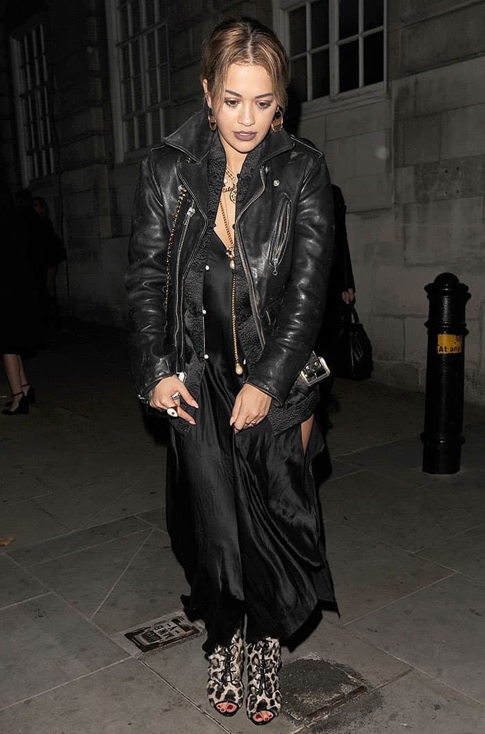 Rita Ora made a striking entrance in a dramatic black maxi dress at Dave Gardner's 40th birthday party