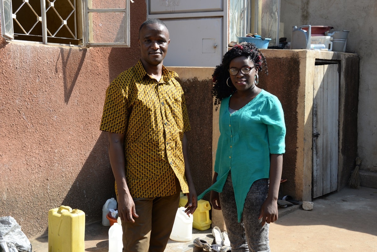 Robert Katende, founder of the Som Chess Academy, with Phiona Mutesi, a chess prodigy he discovered and whose life is the basis for the 2016 film Queen of Katwe