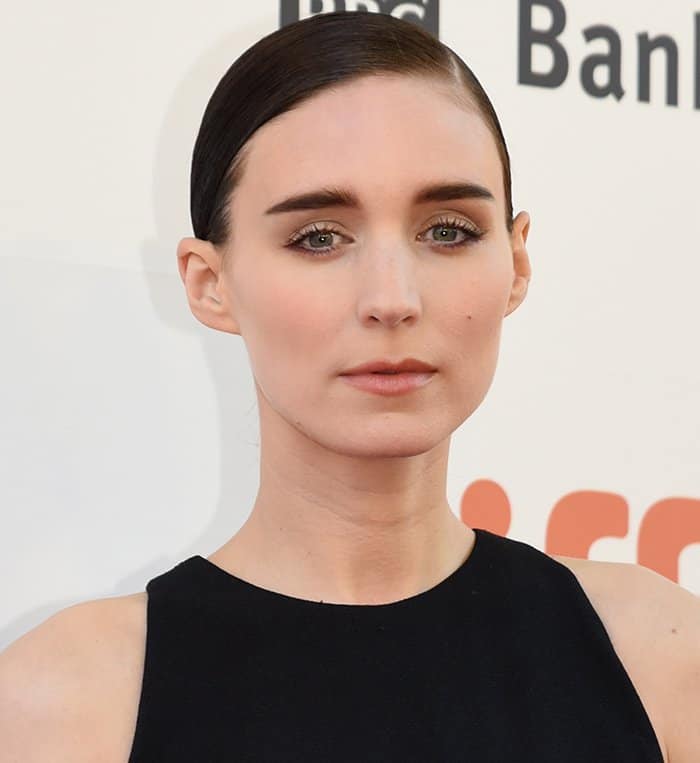 Rooney Mara's sleek side-parted bun and understated makeup provided the finishing touches to her look on the red carpet during the premiere of her new movie The Secret Scripture