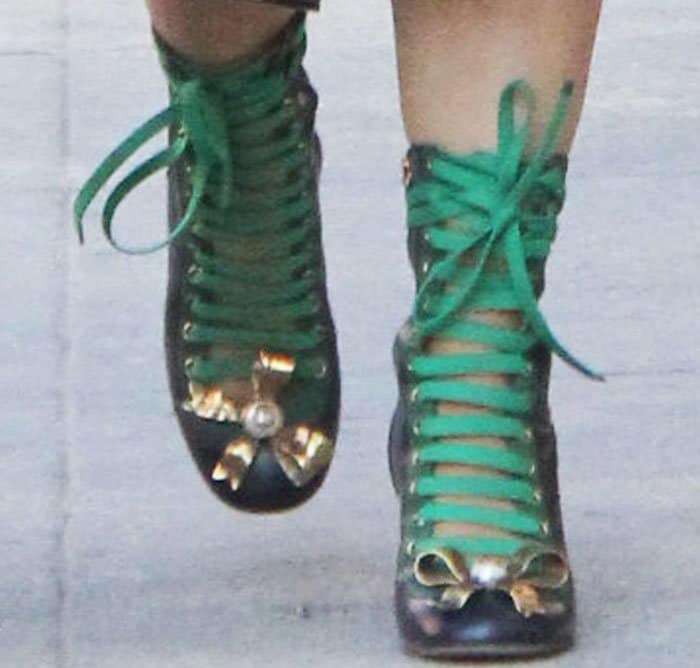 Salma Hayek's feet in colorful lace-up Gucci boots