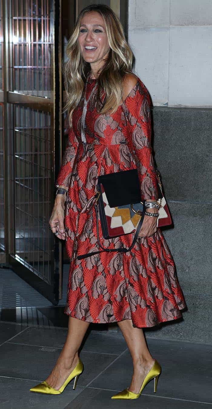 Sarah Jessica Parker stuns in a vibrant Emilia Wickstead brocade dress, paired perfectly with mustard yellow satin pumps