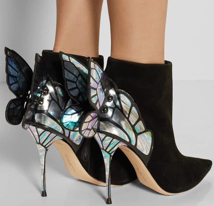 Crafted from supple black suede, these whimsical ankle boots are designed with the label's signature butterfly wings made from iridescent patent-leather