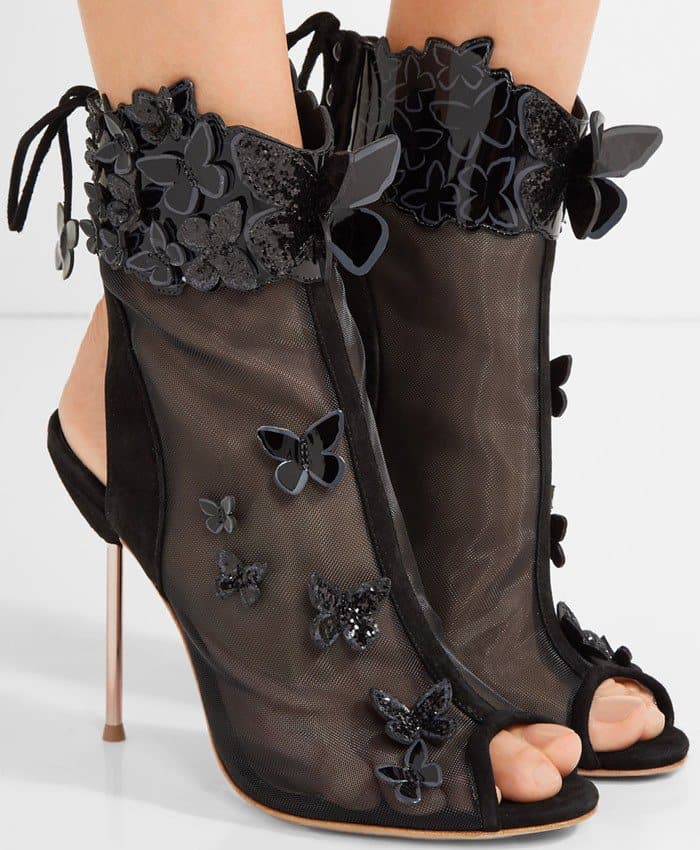 Appliquéd with fluttering patent-leather butterflies and trimmed in suede, this pair has a mesh upper and an adjustable lace-up back