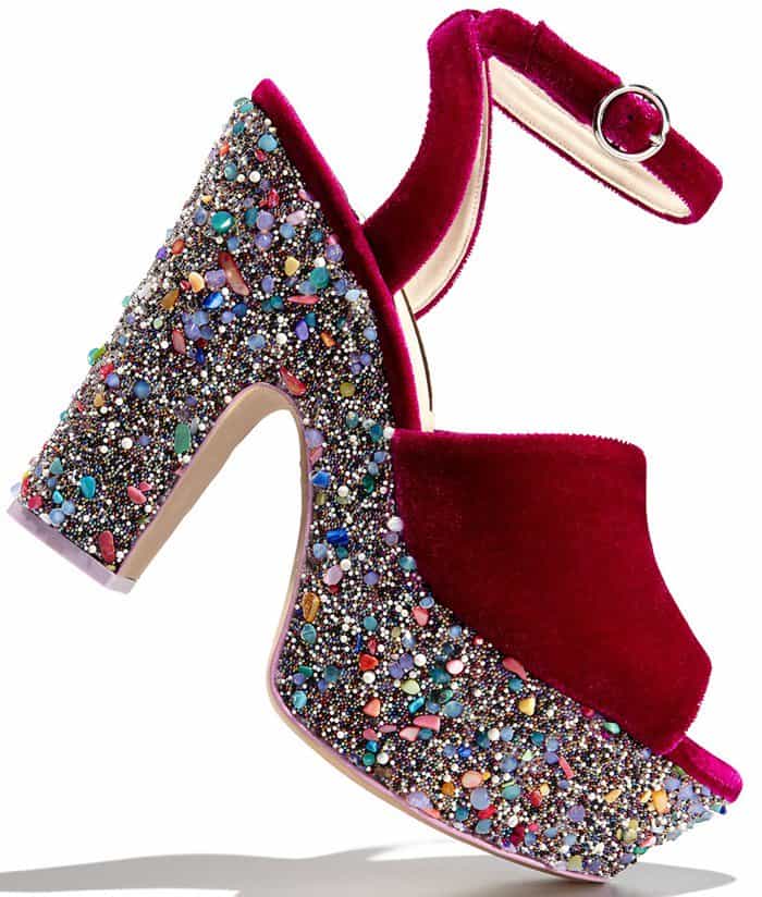 These velvet platform sandals are set on a chunky platform encrusted with kaleidoscopic crystals, resin pebbles and beads