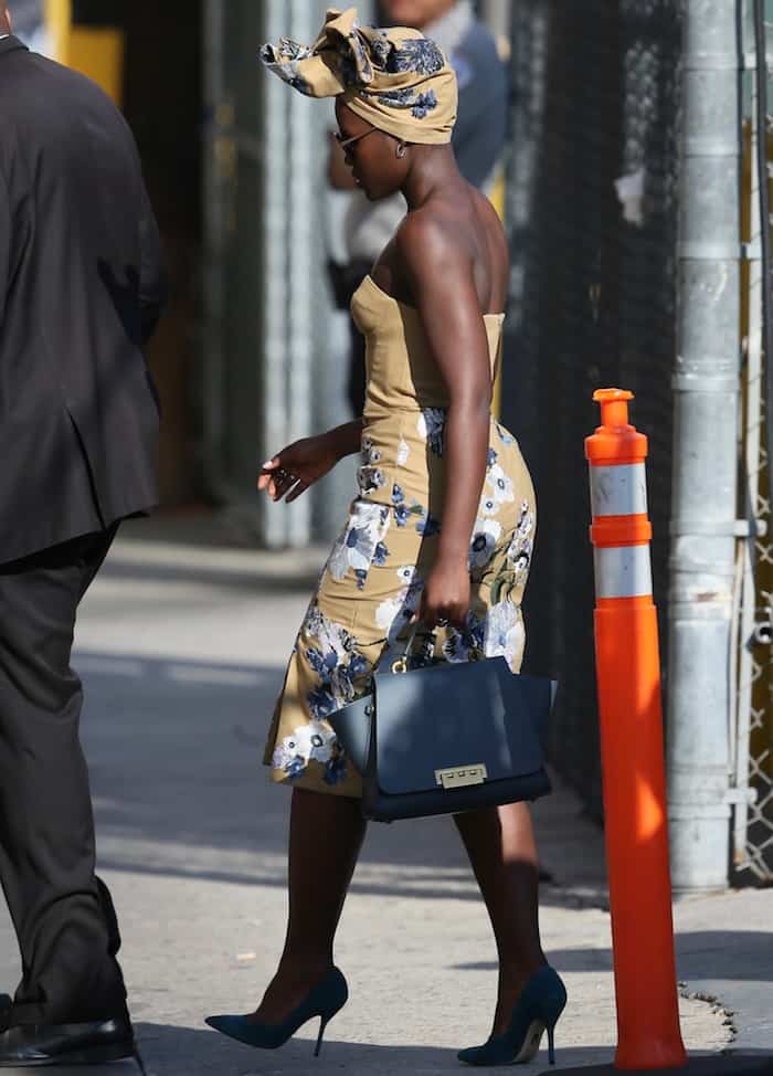 During her appearance on "Jimmy Kimmel Live," Lupita Nyong'o radiated elegance in a bespoke Erdem dress, complemented with a coordinating headwrap