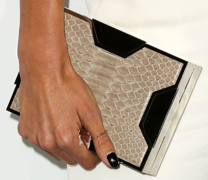 Alessandra Ambrosio chose a reptile-print Space clutch from Lee Savage for the night